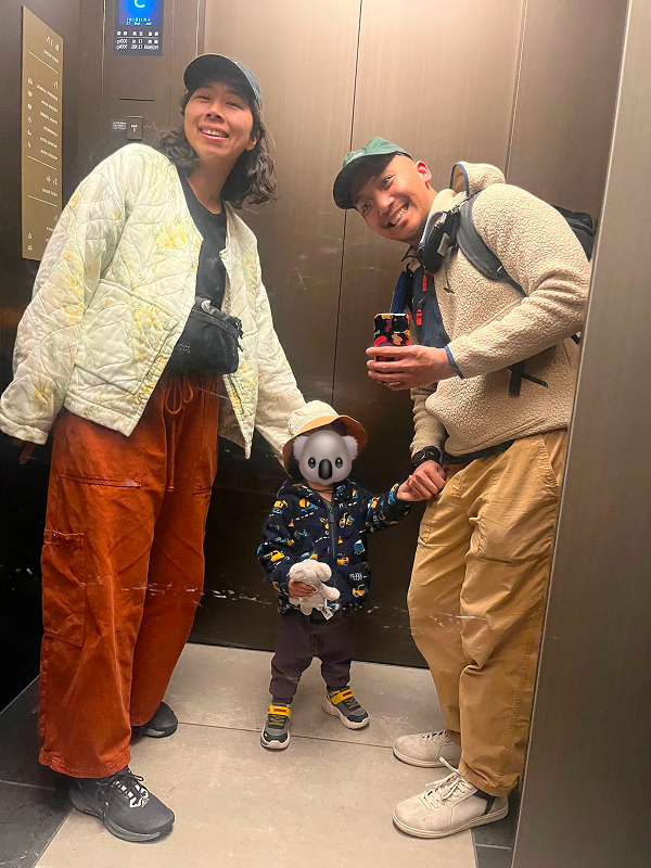 Yoko, Kevin, and Aki taking an elevator selfie in a hotel in Yokohama
