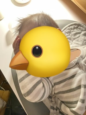 Photo of a baby, about 6 months old, lying down on a changing pad, head turned to the side, eyes closed, mouth closed with tongue out, hand on forehead, as if hungover.
